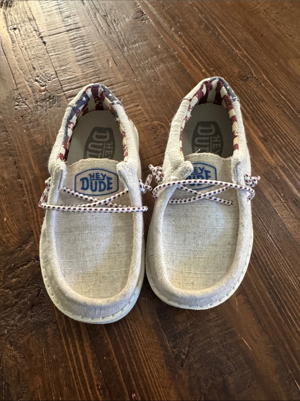 Hey Dude Kids Slip-On Sneakers in Beige with Red-White Trim